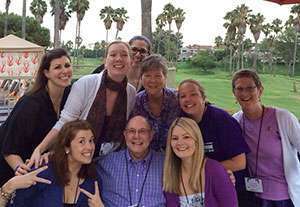 Larry Matulsky surrounded by volunteers and staff at  Community Engagement Leadership Training 2014