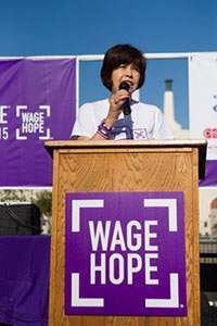 Three-year survivor Lupe Romero speaks about her pancreatic cancer journey at the PurpleStride Los Angeles event