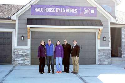 Charlotte Garrett -Donor and Corporate Ambassador, Larry Grego - Owner of LG Homes, Kathy Grayson – Kansas City Affiliate Chair, Brad Lee – Honorary PurplyStride Chair, Jake Coleman – Media Relations Chair standing in front of the second Halo House
