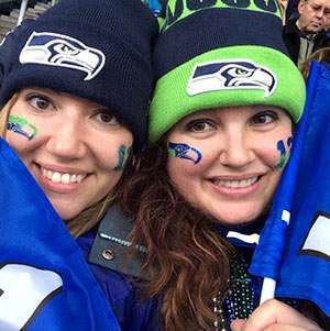 Liz Jurcik (left) and her friend, Hilary, pulling for the Seattle Seahawks during football season. Jurcik is a three-year pancreatic cancer survivor.