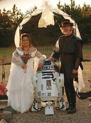 Kevin Doyle and his wife, Eileen, with ring bearer R2-D2 on their wedding day in October of 2009.
