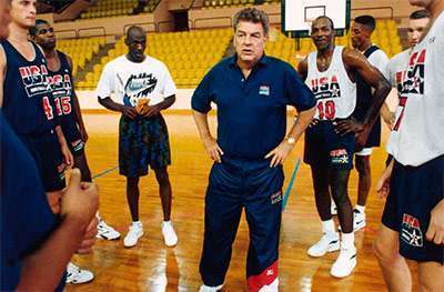 Chuck Daly in a huddle during practice with the 1992 Olympic “Dream Team.” (Photo courtesy of si.com)