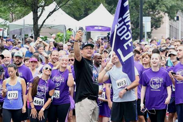 Coach Ron Rivera rallies participants before PurpleStride.