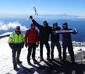Joe with his nephews and friends summiting Mount Adams.