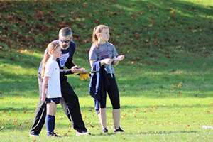 Joe, with two of his daughters, coaching soccer. He has coached girls soccer for 10 years and got back to it this fall.  