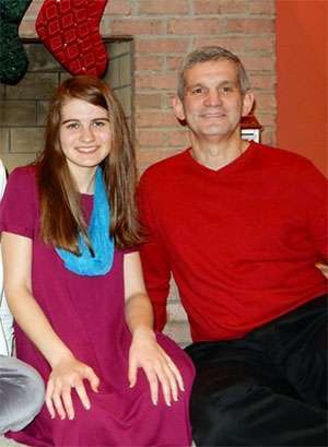 Teenage daughter and volunteer Nikki Cronin with her father Dennis, a seven-year survivor.