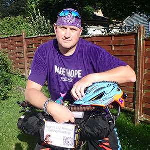 Robert with his bike, to fundraise for pancreatic cancer.