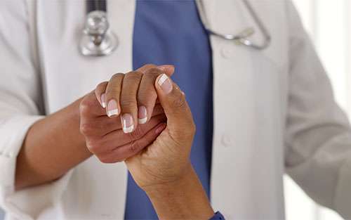 Doctor examines a stage 4 pancreatic cancer patient. 