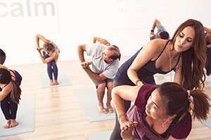 Students of diverse backgrounds attend Lauren Eckstrom’s yoga class for compassionate support