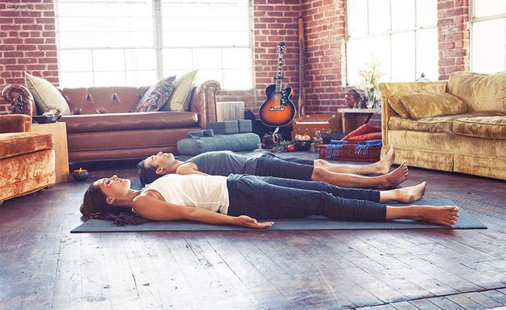 Yoga teacher Lauren Eckstrom demonstrates simple breathing exercise to relieve stress