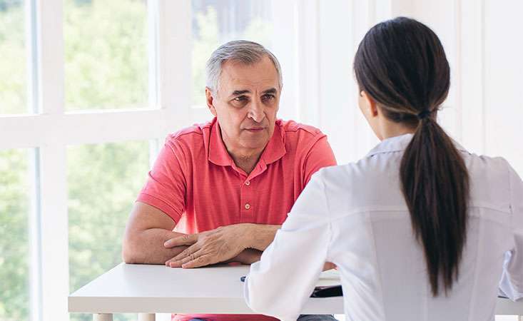 Man talks to doctor about his pancreatic cancer prognosis