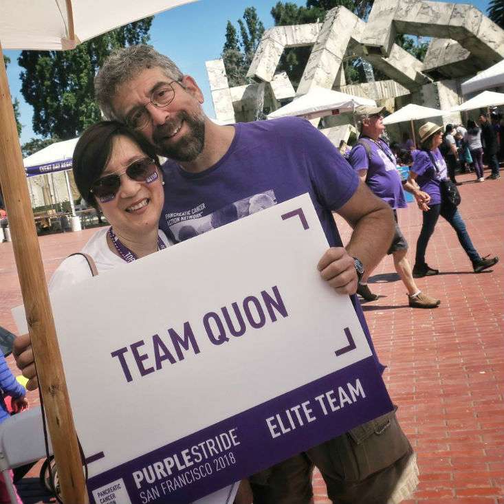 16-year survivor and husband hold a sign for walk to end pancreatic cancer in San Francisco