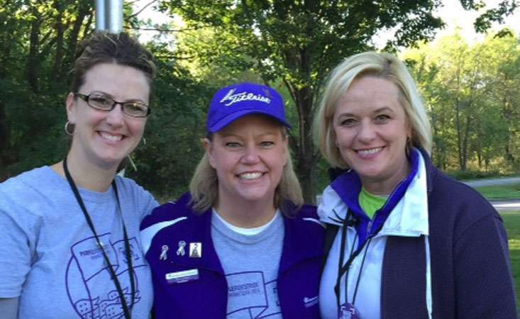 2015-09-19_PurpleRideStride 2015_April Johnson_Teri Larson_Lisa Beckendorf: Lymphoma survivor Teri Larson gathers with fellow volunteers at pancreatic cancer event