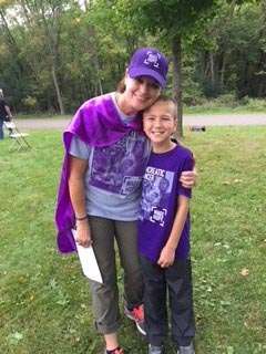 Pancreatic cancer 20-year survivor and a child at a bike/walk fundraiser event in Minnesota