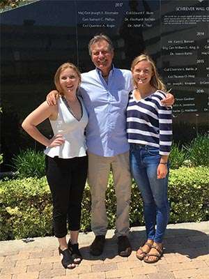 Long-term pancreatic cancer survivor with his daughters