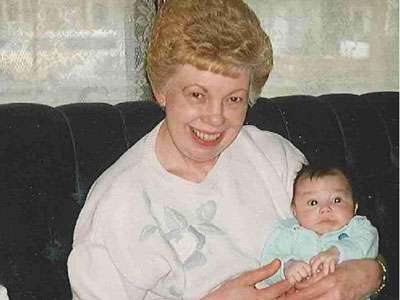 Jane Johnson, Teri Larson’s mother, holding her grandchild