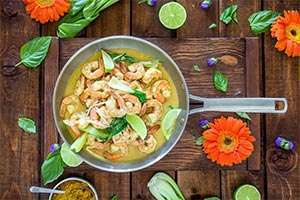 Healthy shrimp sauté cooking in a veggie lime sauce.