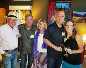 Long-term pancreatic cancer survivor with friends and family at wine tasting in San Jose, Calif.