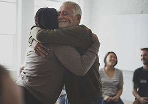 Pancreatic cancer patients and their loved ones attend a support group to encourage each other