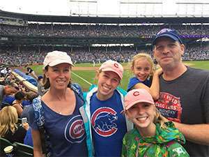Supporter of pancreatic cancer cause with his wife and three daughters at Chicago Cubs game.