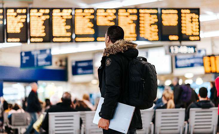 A pancreatic cancer patient waits for a flight after getting his doctor’s approval to fly