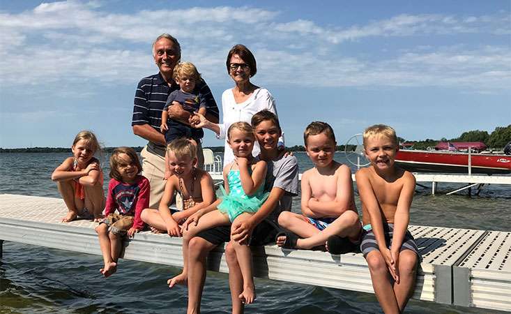 Pancreatic cancer survivor on a lake in Minnesota with his wife and grandchildren