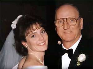 Daughter at her wedding with her father who she lost to pancreatic cancer in 2013 