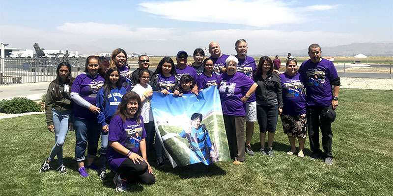 Family members of Lupe Romero, who died of pancreatic cancer, skydive in tribute to her.