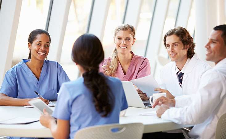 A multidisciplinary team meets to discuss their pancreatic cancer patient’s progress