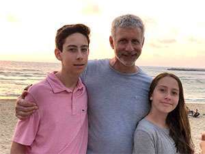 Pancreatic cancer expert Dr. Andrew Lowy relaxes at the beach with his son and daughter