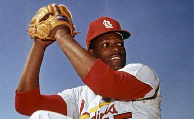 Baseball Hall of Famer Bob Gibson winds up to throw one of his famous right-handed pitches.
