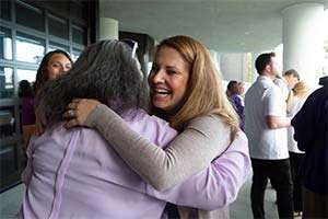 Pancreatic Cancer Action Network employee hugs a volunteer leader at 2019 national conference