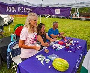 PanCAN volunteers give information about pancreatic cancer to Dirty Dancing Festival attendees 