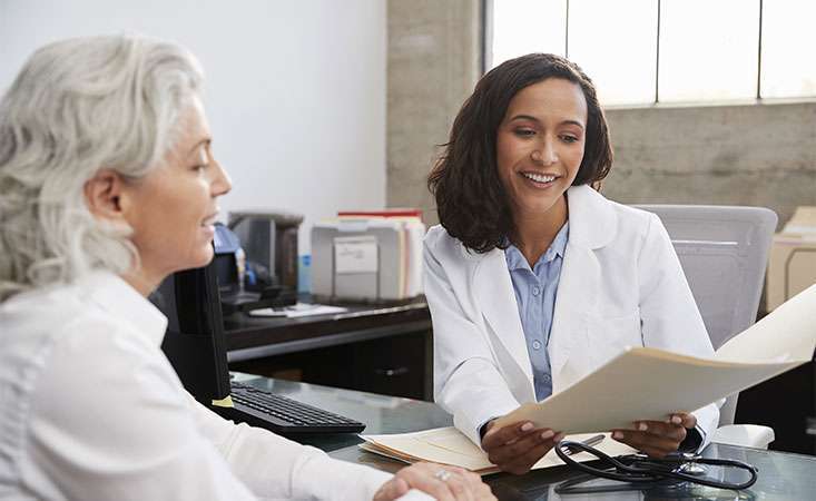 Pancreatic cancer patient reviews her molecular profile report with her doctor