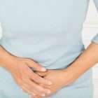 Woman experiencing stomach pain, a pancreatic cancer symptom