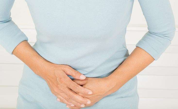 Woman experiencing stomach pain, a pancreatic cancer symptom