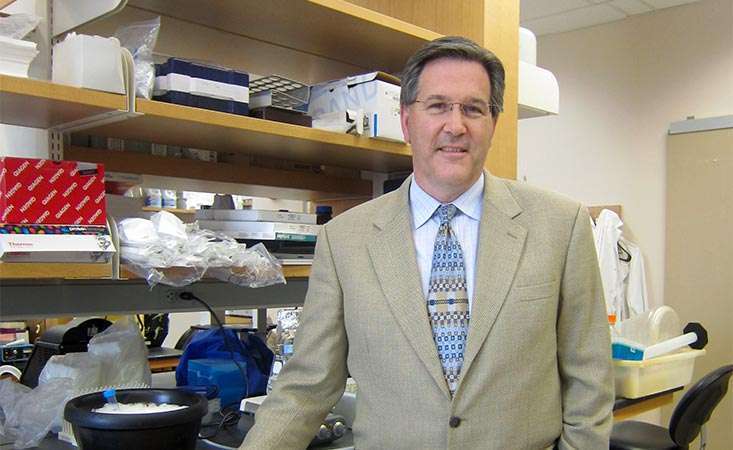 Pancreatic cancer researcher in lab focused on personalizing treatment for patients