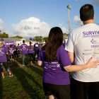 Pancreatic cancer survivor with participant at PanCAN’s PurpleStride walk/run event