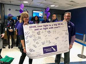 American Airlines employees support pancreatic cancer survivor at New York’s LaGuardia Airport