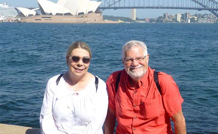 Pancreatic cancer survivor and his partner in front of the Sydney Opera House in Australia