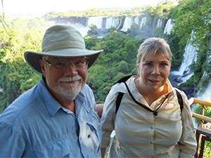 Stage 4 pancreatic cancer patient and his partner in front of Iguazu Falls in Argentina