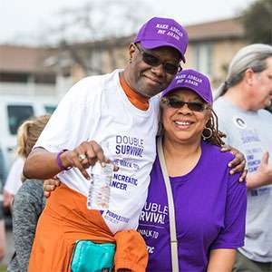 Stage 4 survivor and his wife smile at PurpleStride Austin walk to end pancreatic cancer