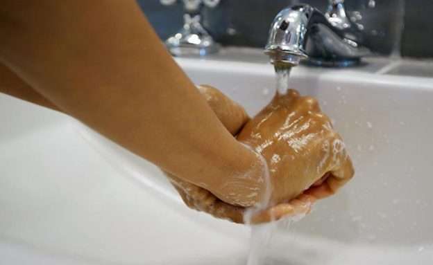 Pancreatic cancer patient washes hands to avoid exposure to coronavirus disease (COVID-19)