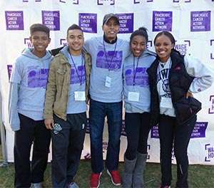 Volunteer leader for PurpleStride walk with young fellow participants to fight pancreatic cancer