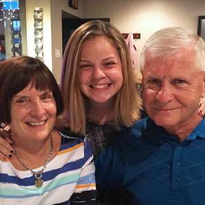 Pancreatic cancer survivor with his wife and granddaughter