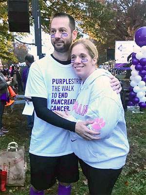 Husband and wife at PanCAN PurpleStride event.
