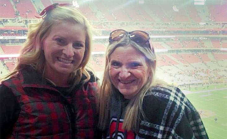 Close up of mom and daughter smiling