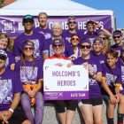 Stage 4 pancreatic cancer survivor with friends and family at PanCAN PurpleStride event