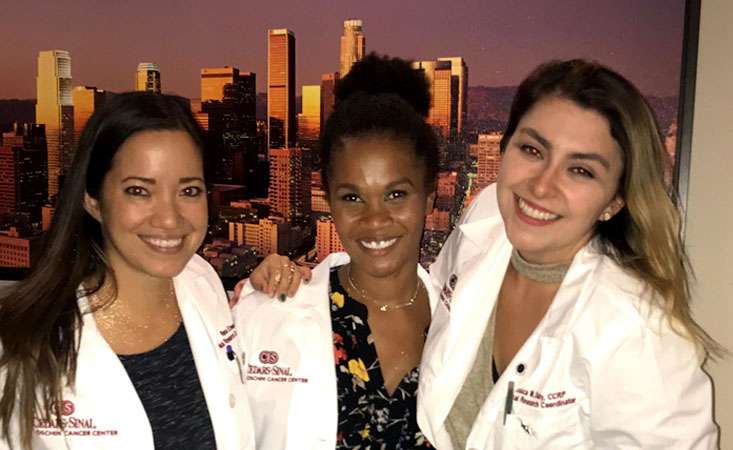 Karla and two other women in nursing attire smiling