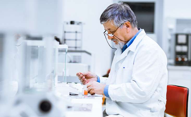 Pancreatic cancer researcher examining blood sample